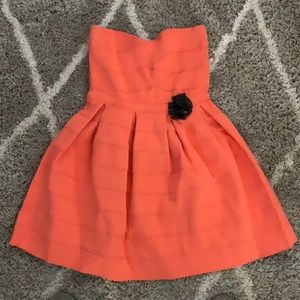 Coral Strapless party dress with blak detail